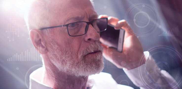 Senior businessman talking on mobile phone, light effect, double exposure with graphs - Powered by Adobe