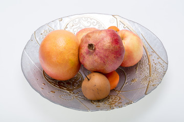 mix fresh fruits on plate isolated on white