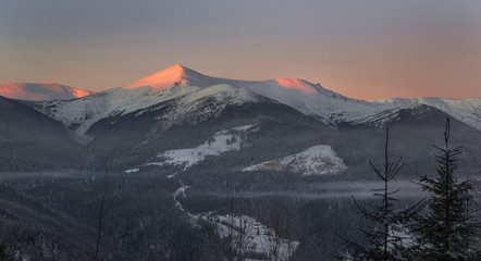 Illuminated mountains - winter scene