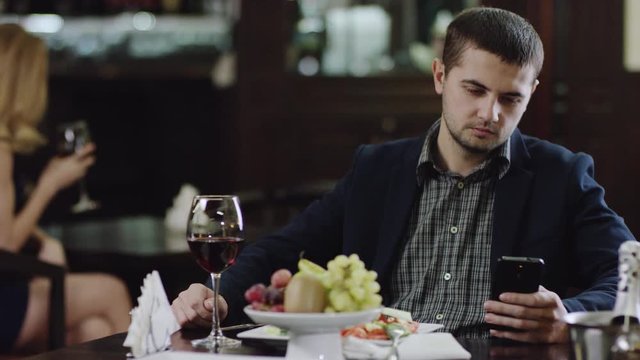 blondie looking fliting with man in restaurant