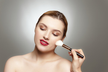 Fototapeta premium Master is brushing female carefully.