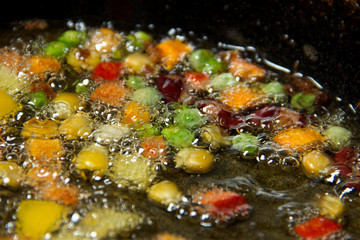 stewed vegetables in butter in a frying pan boil. homemade food. yum-yum