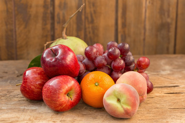 Fruits diet concept. different fruits on wooden table