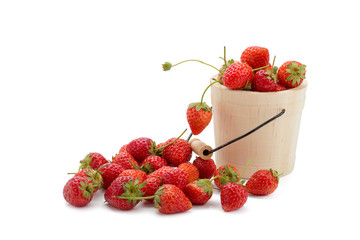 Strawberries in a wooden bowl on a white background.