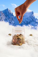surreal putting euro coins in a big jar