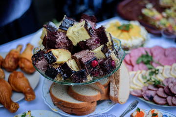 Pieces of homemade cheesecakes and chocolate bisquits