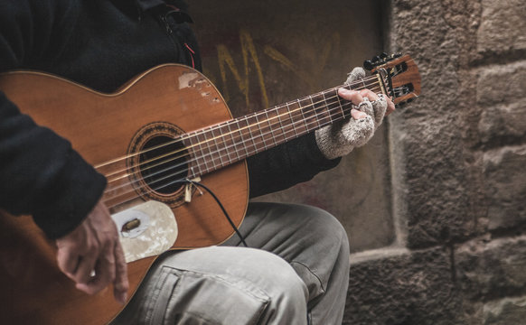 Street musician playing the guitar