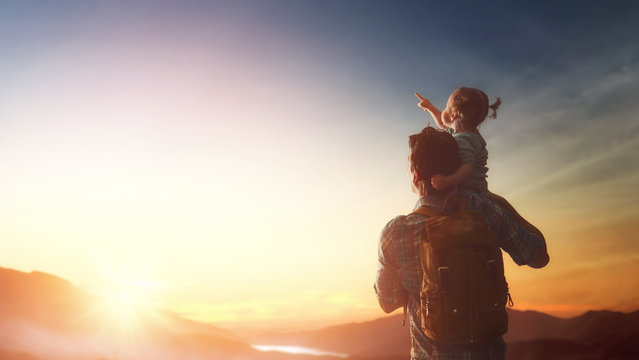 Father and baby at sunset