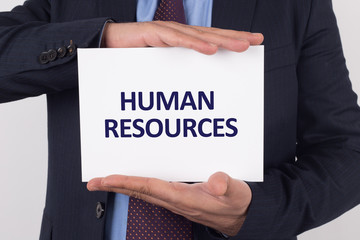 Man showing paper with HUMAN RESOURCES text