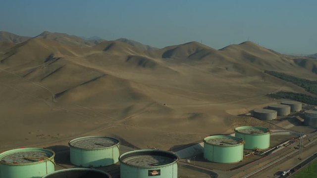 Ventanilla Peru Aerial v17 Flying low over oil refinery panning.