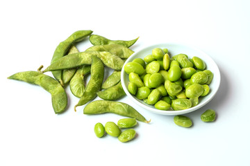Green soybeans on white background