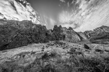 The sheer rock walls. Beautiful landscape of sharp cliffs. Dry grass grows on the slopes of the mountains. Smith Rock state park, Oregon