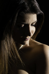 High contrast of brunette woman portrait