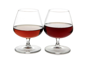 Glass with brandy and cognac on white background