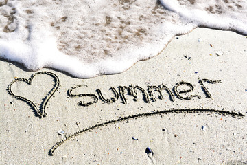 I love summer concept written on the tide washed beach 