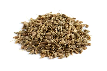 Gordijnen Pile of of dried anise seed (aniseed) isolated on white background © nedim_b