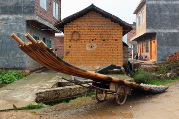 Obraz premium Bamboo raft on a cart in a village near Yangshuo town in Guangxi province, China. Rafting is a popular attraction among domestic and foreign tourists.