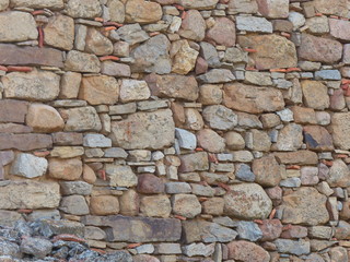 Obraz premium verfugte mediterrane Mauer aus Naturstein als Hintergrund 