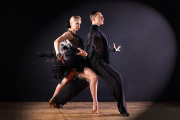 dancers in ballroom isolated on black background