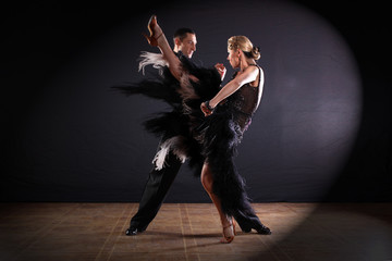 dancers in ballroom isolated on black background