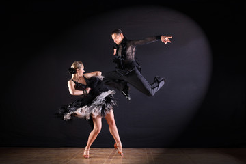 dancers in ballroom isolated on black background