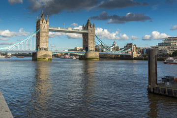 Fototapeta na wymiar LONDON, ENGLAND - JUNE 15 2016: Tower Bridge in London in the late afternoon, England, Great Britain