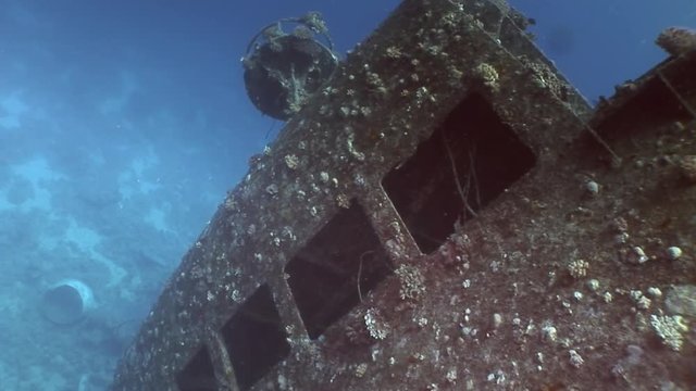 Window close up in Salem Express shipwrecks underwater in the Red Sea in Egypt. Extreme tourism on the ocean floor in the world of coral reefs, fish, sharks. Researchers of wildlife blue abyss.