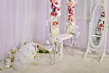 swing decorated with flowers