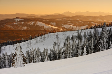 Fototapeta na wymiar Majestic sunset in the winter mountains landscape. Beskids, Rysianka, view from Tatra