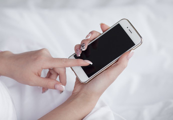 Woman's hand holding mobile phone designed for new modern life style and easy shopping online concept