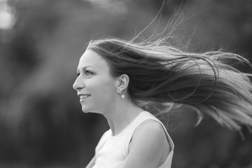 Monochrome portrait of a young woman wiyh long hair