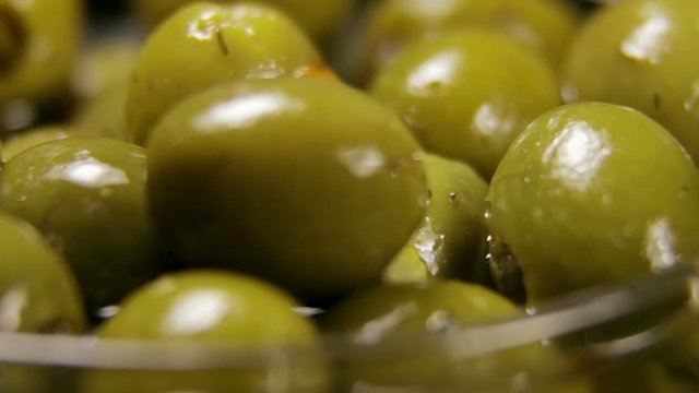 Olives in olive oil. video rotation