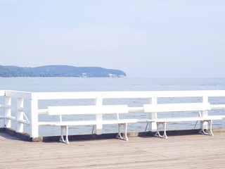 View of Baltic Sea, pier and blue sky in Sopot, Poland. May 2016. Molo with bench by the sea