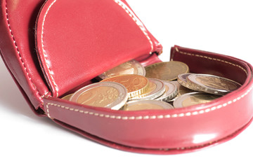 Ein Portemonnaie und viele Euro Münzen