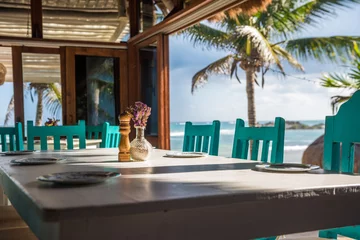 Zelfklevend Fotobehang Seascape tropical beach restaurant, shallow focus © javarman