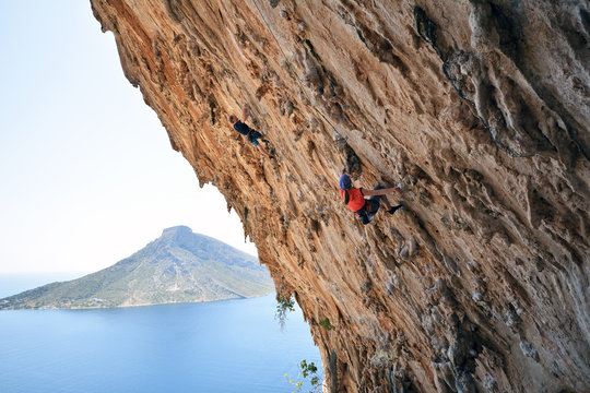 Greece, Kalymnos, two climbers in rock wall