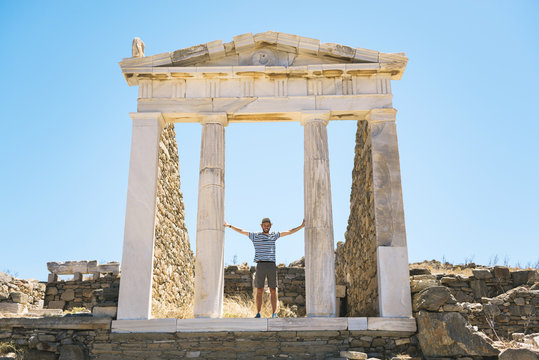 Greece, Mykonos, Delos, tourist visiting the Temple of Isis
