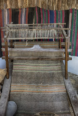 A traditional vintage bulgarian weaving loom with rug