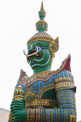 standing giant guard statue in The Emerald Buddha temple in Bangkok, Thailand