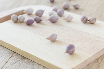 Fototapeta na wymiar Garlic on wood cutting board