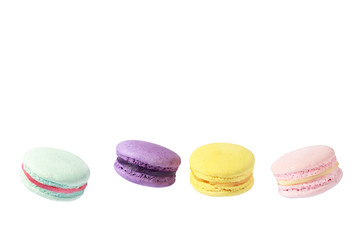 Four colorful macarons isolated
