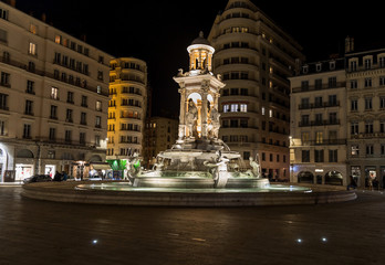 Fototapeta na wymiar Fountain on Jacobin's square at night