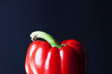red paprika with black background
