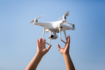 Drone start flying take off to the beautiful sky