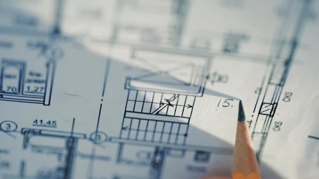Architect working on blueprint close-up