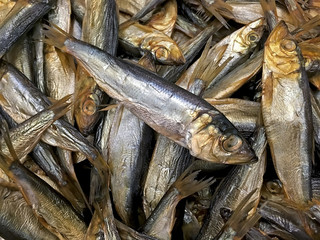 Many smoked fish sprats closeup