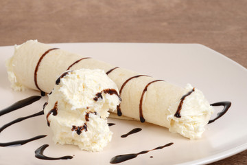 closeup vanilla ice cream crepe with chocolate sauce