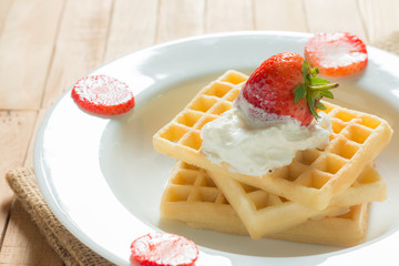 Waffle with strawberry and whip cream