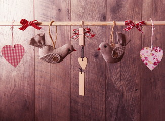 Two birds and heart as a symbol of love and valentines day card. Easter background. Wedding background. Valentine's day background. Retro style toned picture