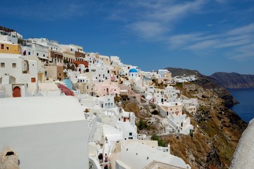 Fototapeta premium Santorini - the volcano among the Cyclades, Aegean sea. Island's capital, Fira, which is situated on the edge of a cliff. Known for distinctive architecture in white and blue colours